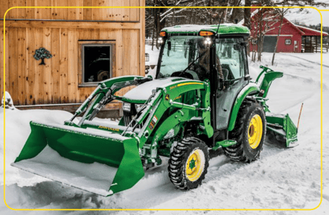John Deere compact tractor with cab