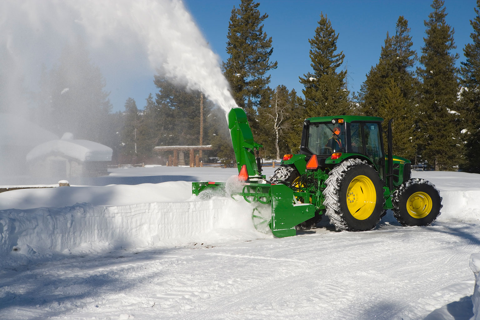 Blowing snow using a SB1309R Snowblower on 6330 Tractor
