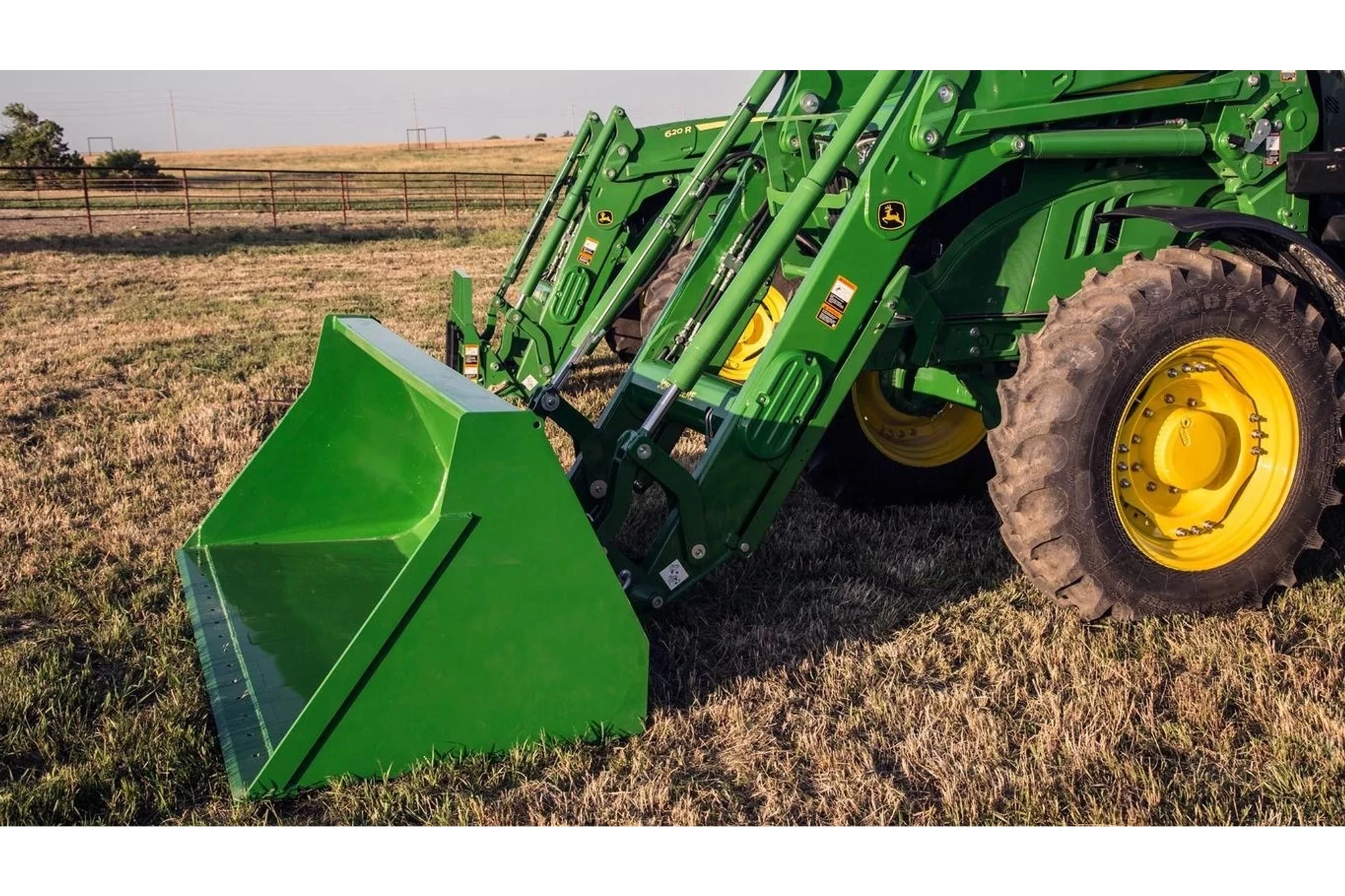 660R Front End Loader with a close up of the bucket attachment in a field
