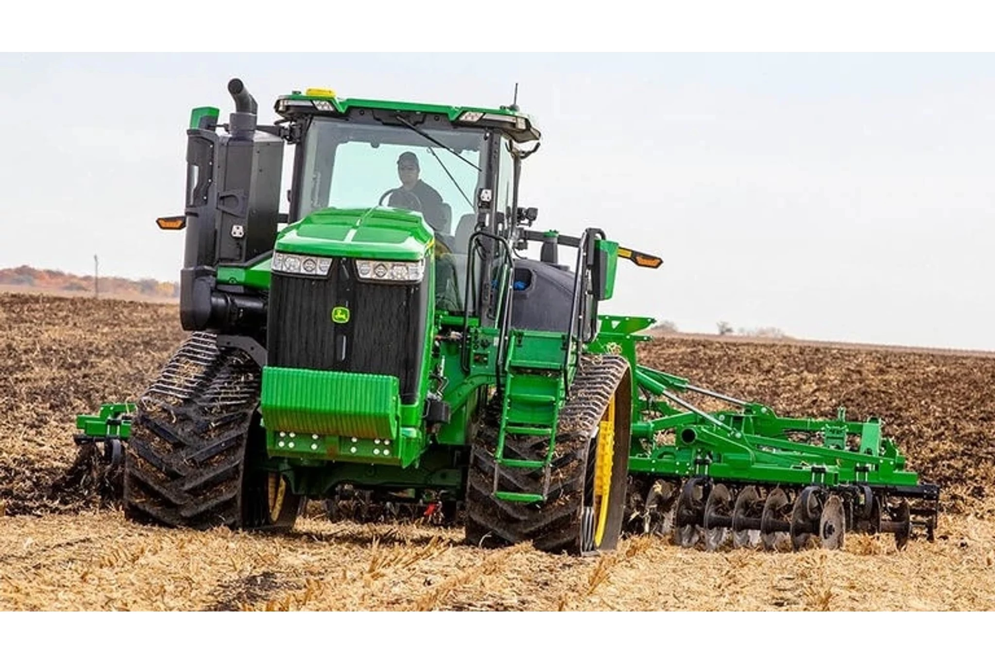9RT 490 Tractor tilling a corn field