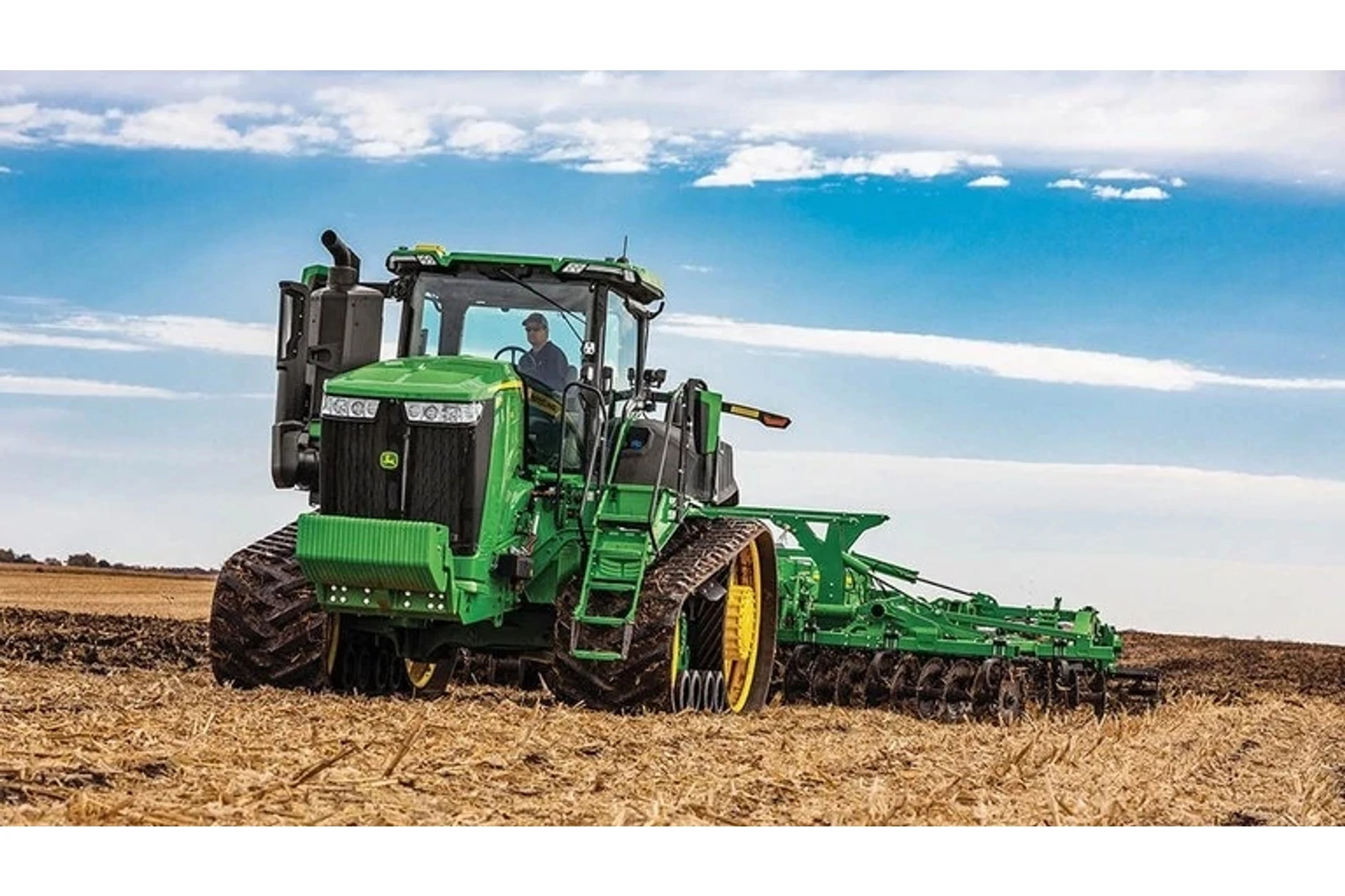 9RT 540 Tractor tilling a corn field