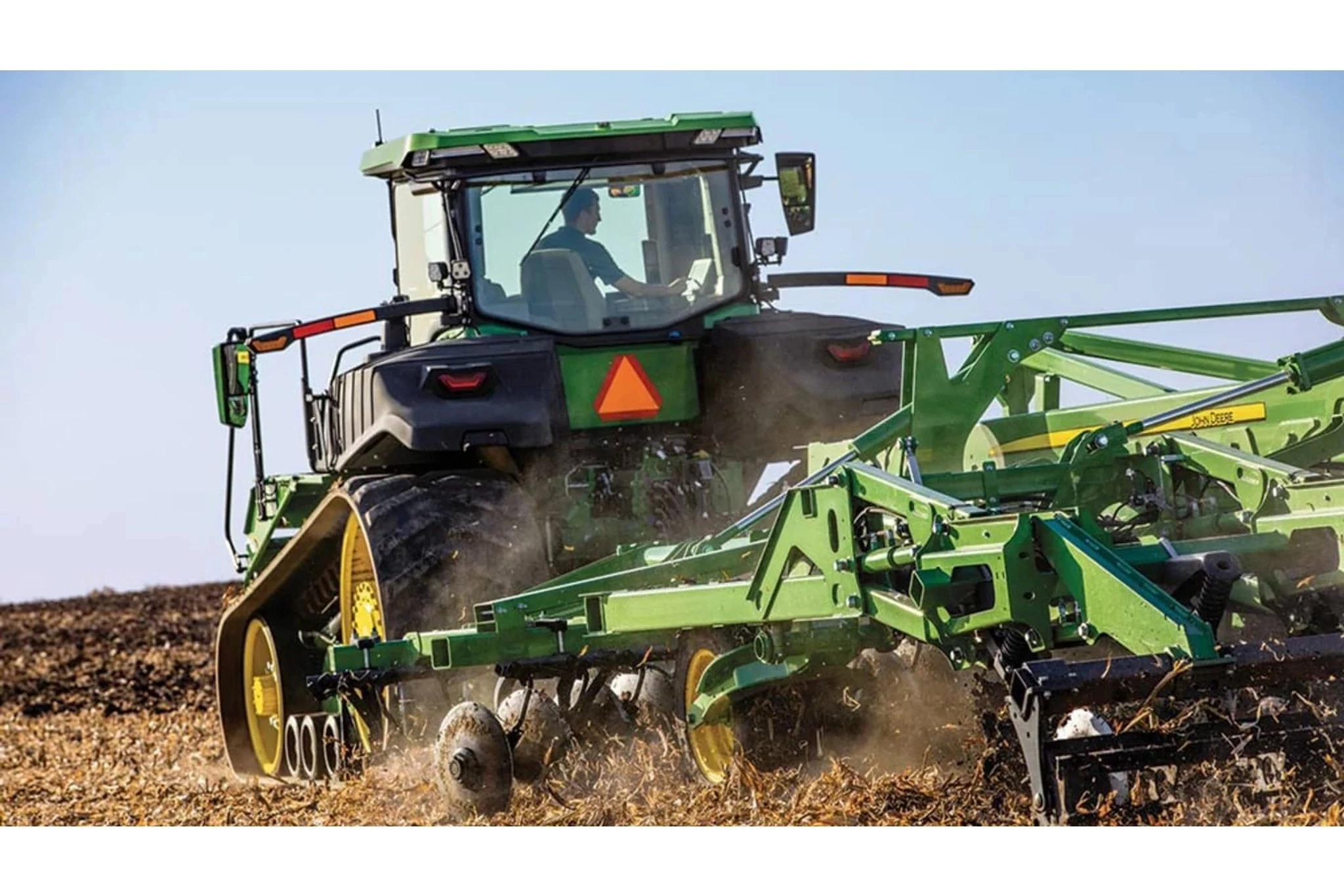 9RT 590 Tractor tilling a corn field