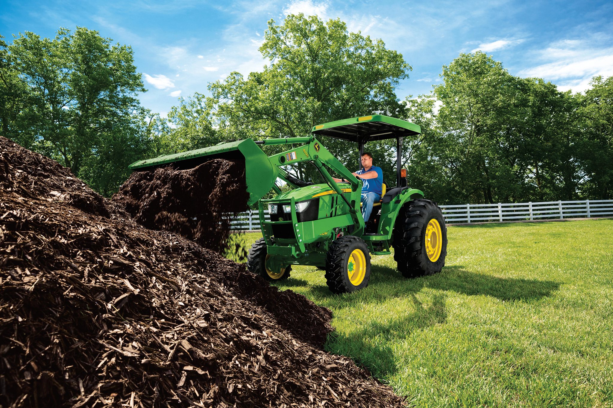 400E Loader picking up dirt in field