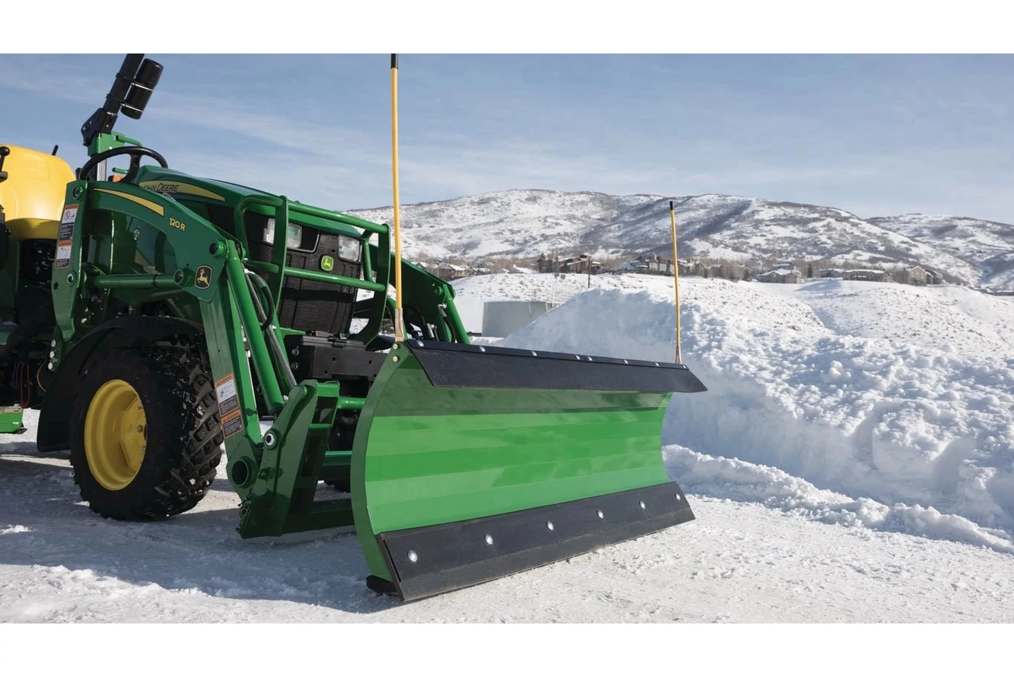 Front right view of AF10F Front Blade clearing snow from a driveway