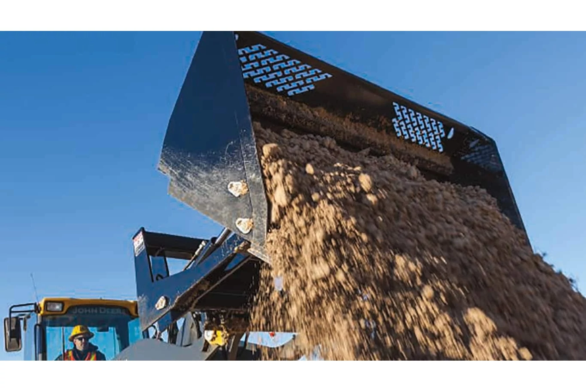 RB Series Rollout Bucket dumping dirt and gravel