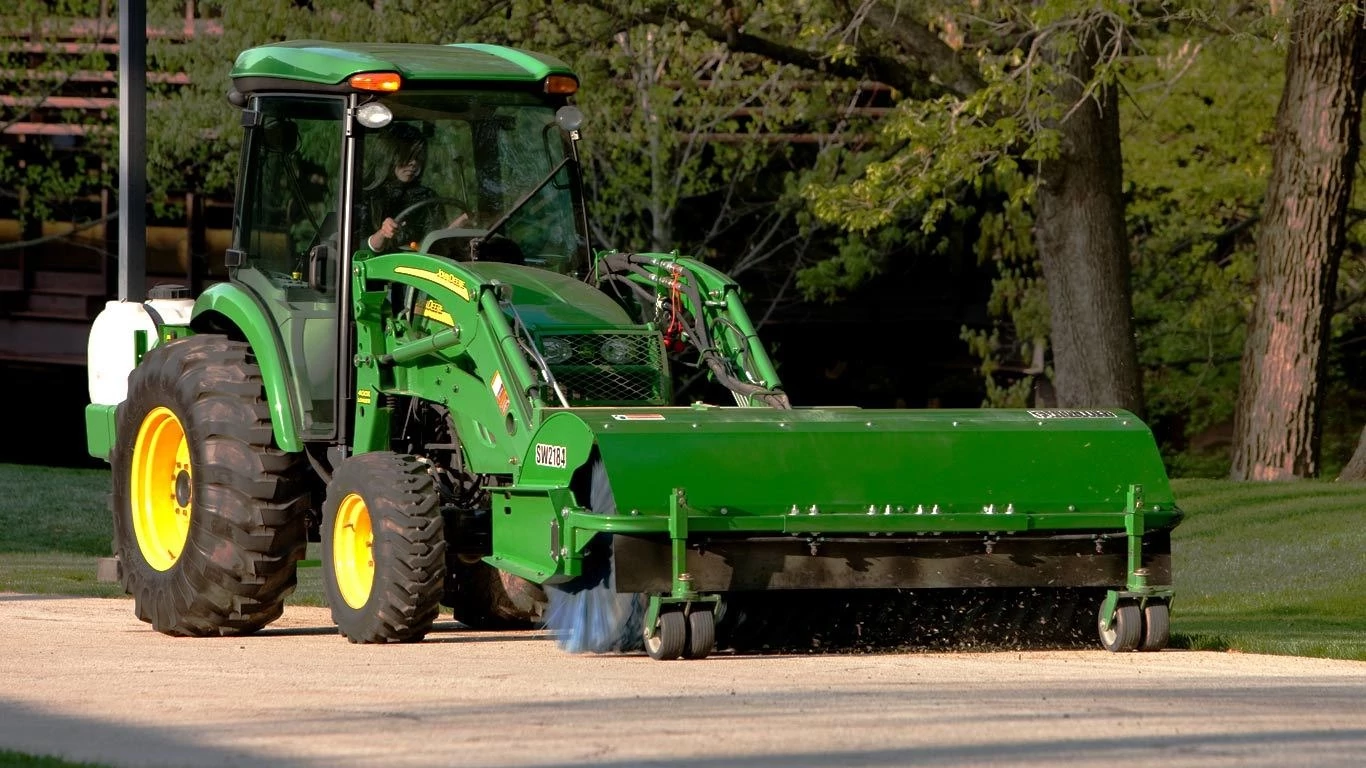 Frontier sw21 rotary broom on tractor displayed in front of headquarters